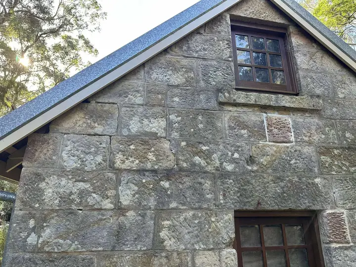 Historic stone building facade prepared for conservation work