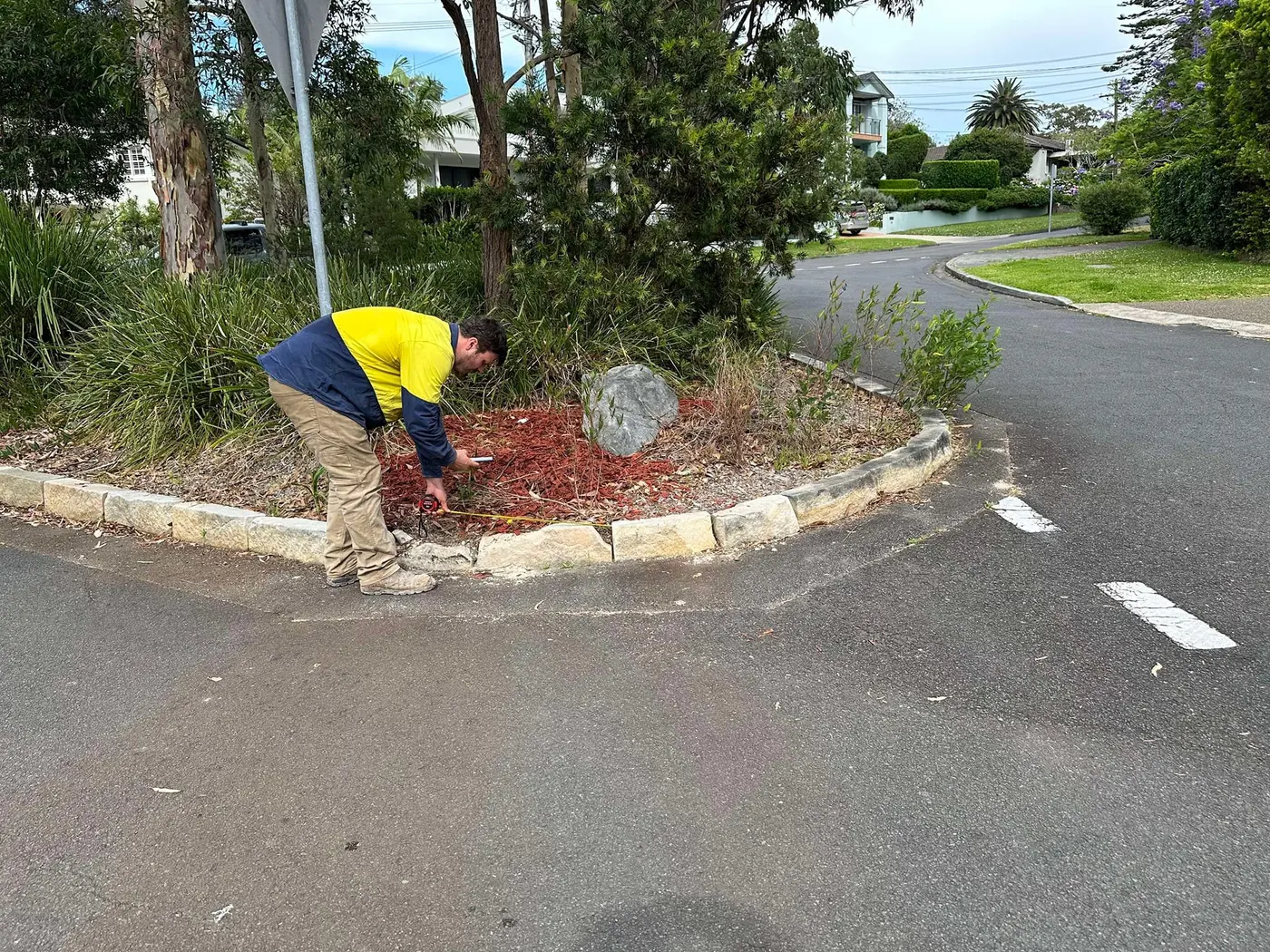 Sandstone landscape edging around a planted area